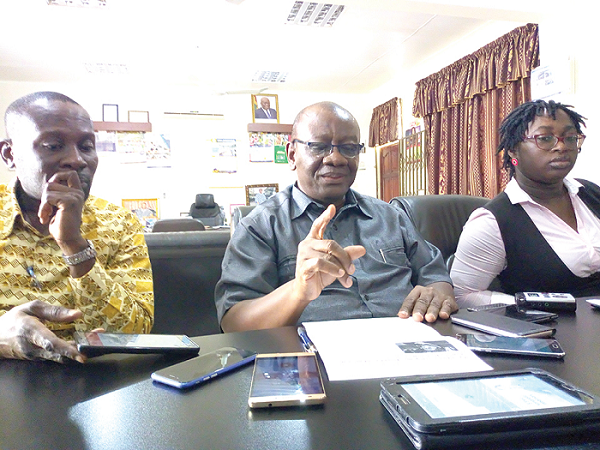 Mr Dartey (middle) addressing journalists. With him are the Legal Officer of (NAB), Mrs Afia Serwaa Essandoh (right), and Mr Lawrence Kwarteng-Ashia, PRO of NAB