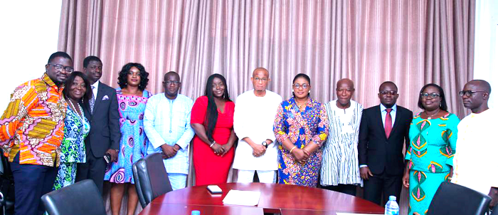 Mr Mustapah Hamid (middle), Minister of Information with the new members of the Ghana Publishing Board