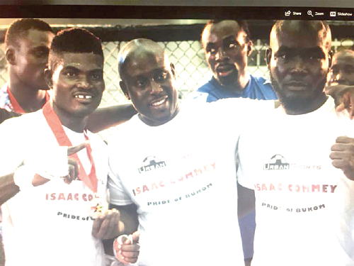    Theophilus Nelson (left) pose with his corner after his triumph