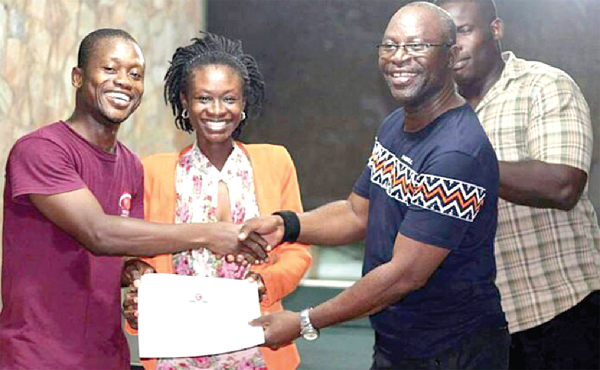 Mr. Tachie-Menson (right) presents an award to Nathaniel Somuah (left) Manager of Tesano Spinners Mr. Tachie-Menson (right) presents an award to Nathaniel Somuah (left) Manager of Tesano Spinners