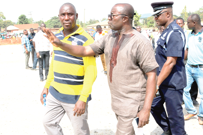  Mr Osei Assibey-Antwi (hand raised) in the company of the Presiding Member of the KMA, Mr Abraham Boadi (left), at the Race Course to ensure sanity after some traders had occupied the area on their own volition. Picture: EMMANUEL BAAH