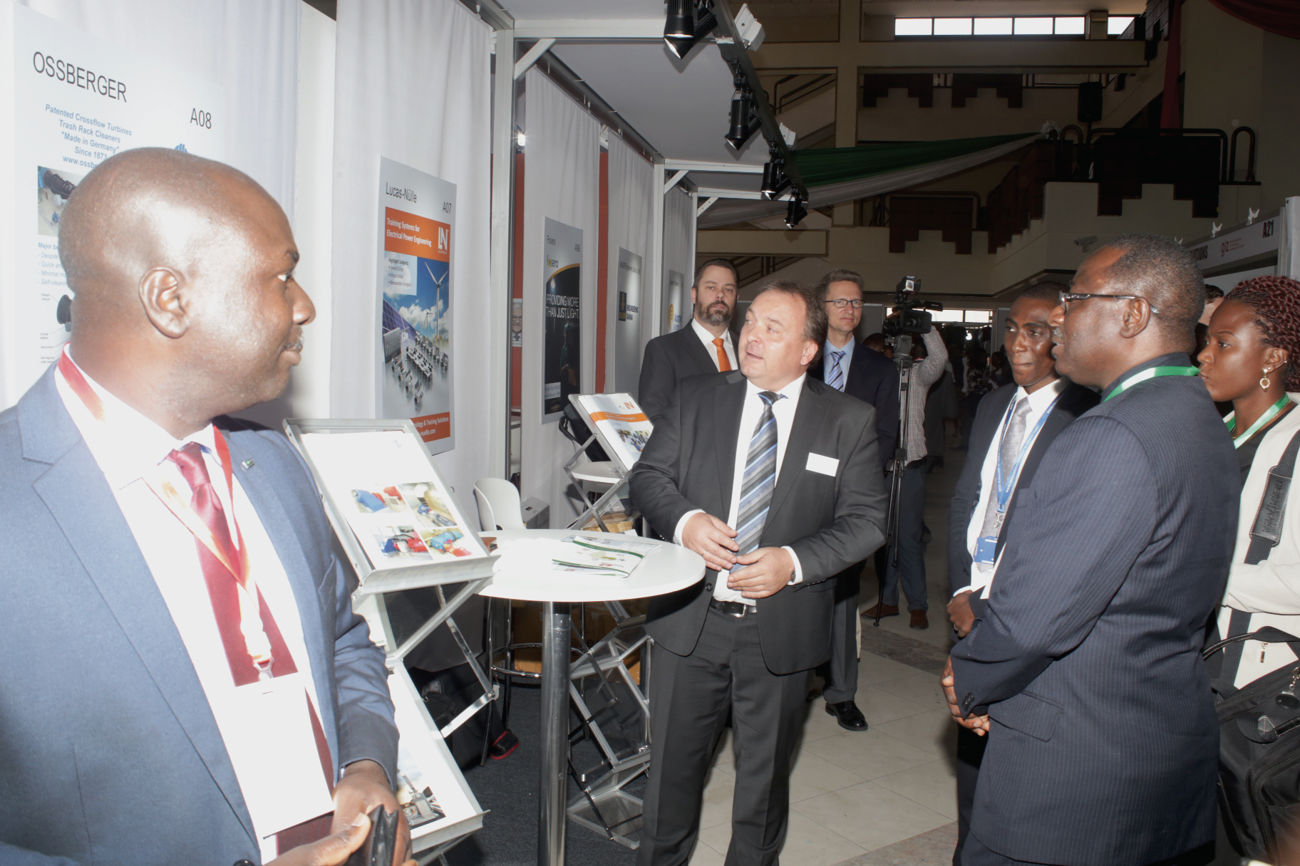 Mr Wisdom Ahiataku Togobo ( right), the Director of Renewable and Alternative Energy of the Ministry of Energy, and other officials at the exhibition on Clean Energy in Accra.