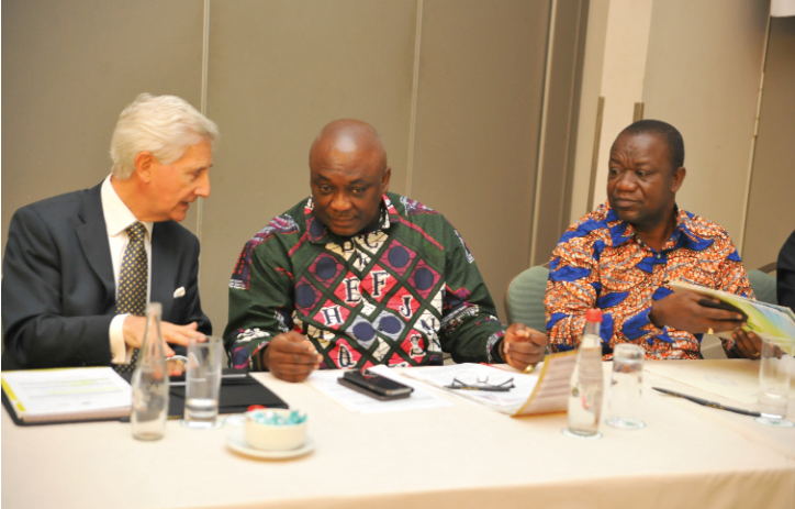 Mr Carlos Ahenkorah (2nd left), Deputy Minister of Trade and Industry chatting with Mr Markus Dutly (left), at the launch. With them is Mr George Boahene K. Oduro, a Deputy Minister of Agriculture. 