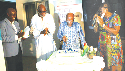 Prof Fred T. Sai (middle), cutting the cake to officially launch the 65th Population Council Anniversary celebration. Looking on is Mr Ayorinde Ajayi (left).  