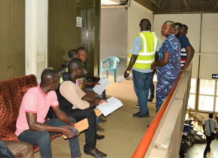 Some agents waiting at the Systems Administration Centre to do a manual check on their documentations