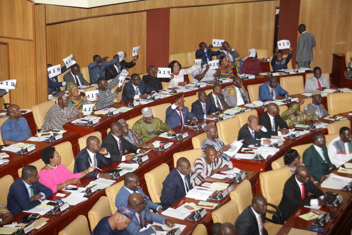 Members of the Minority side displaying  placards  after the budget hearing