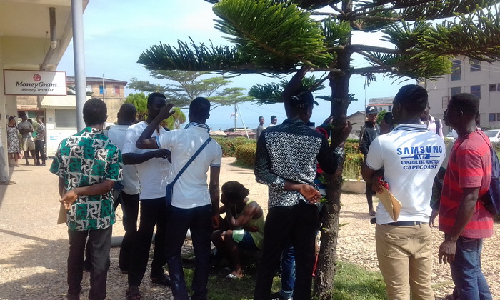 Some applicants standing around the premises of the Ghana Commercial Bank Cape Coast main branch waiting for their turns to apply