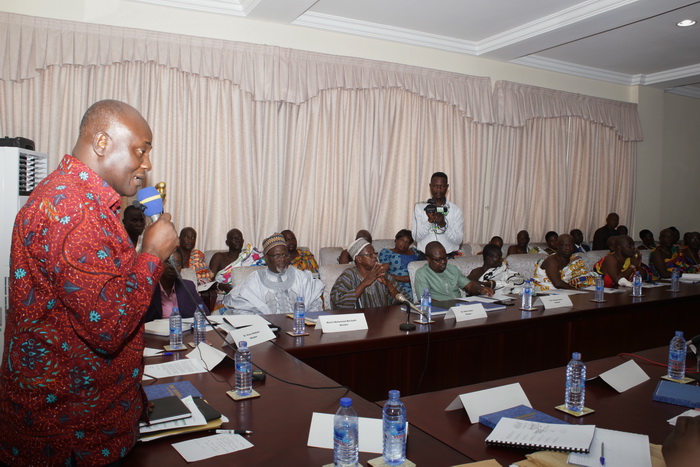 Mr Daniel Kweku Botwe (left),  Minister of Regional Re-organisation and Development addressing the chiefs and the members of the commission.