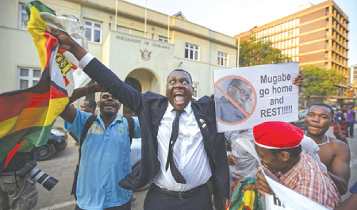 Zimbabweans jubilating after hearing the announcement of Robert Mugabe’s resignation