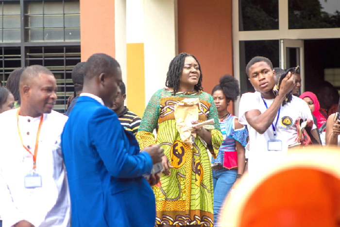  Mrs Mills-Odoi interacting with a participant