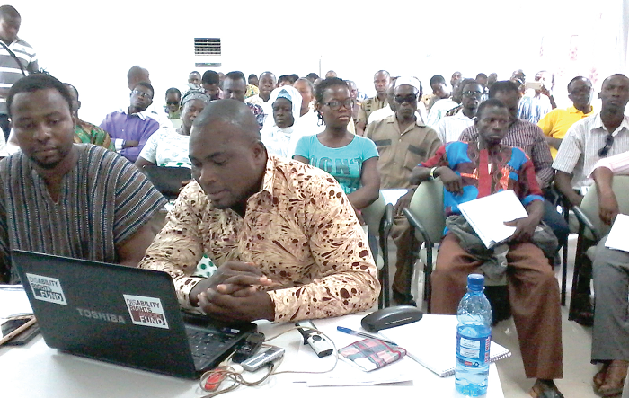 The President of the Ghana Federation of Disability Organisations, Mr David Aniah (2nd left), addressing the press conference