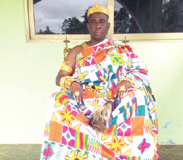 Obrempong Appiah Nuamah exchanging greetings with a guest at the durbar. With them are Osabarima Asare Pinkro and the queenmother of the town, Nana Gyamfua Biraso II