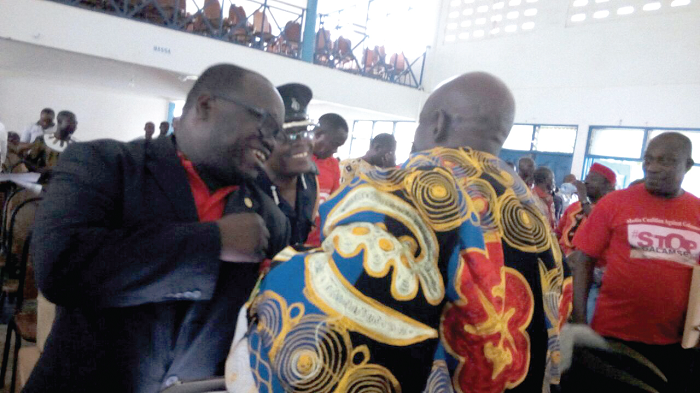 Mr Kenneth Ashigbey (left), Convener of the Media Coalition Against Galamsey, ACP David Eklu (middle) and Tetrete Sekyim II, back to camera, exchanging pleasantries at the meeting