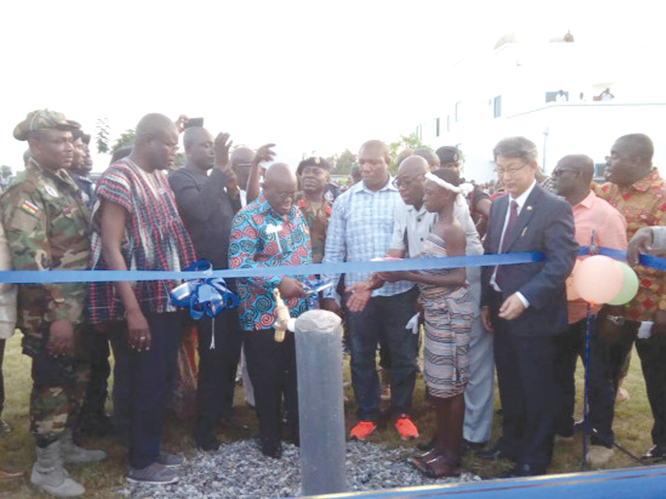 President Nana Addo Dankwa Akufo-Addo about to cut the tape to inaugurate the Wa water system. INSET: President Akufo-Addo opening the tap