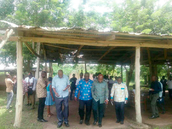 The private wood processing structure occupied by students in Diploma Two being inspected by the deputy ministers and their entourage