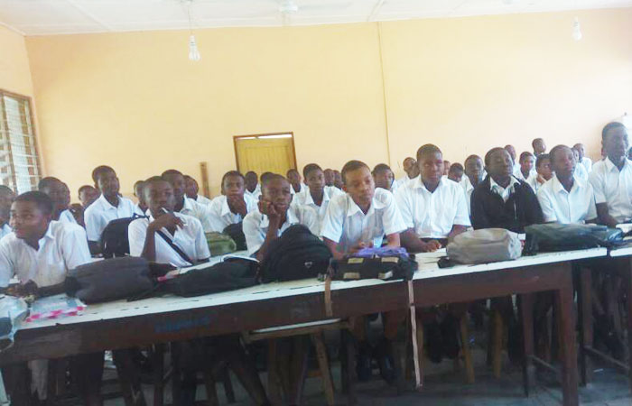 Some students in a science lab which has been turned into a classroom at St Aquinas. Some students in a science lab which has been turned into a classroom at St Aquinas.