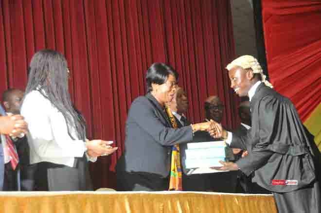 Her Ladyship Sophia Akuffo, the Chief Justice presenting the John Mensah Sarbah Memorial Prize to Mr Isaac Danso Agyiri, the best all-round student in the Professional Law Examination