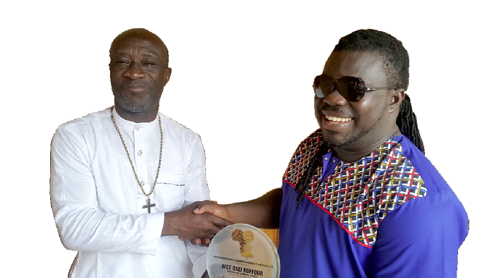 The MUSIGA president, Bike Osei Kuffour (right) receiving his award from Prince Kofi Nyantakyi