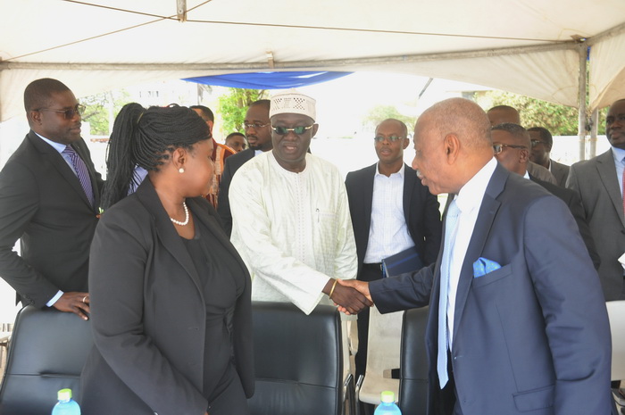  Mr Kofi Adda, Minister of Sanitation and Water Resources (middle) congratulating the management of GWCL for the initiative after the launch