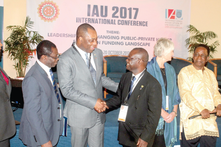 Dr Matthew Opoku Prempeh (2nd left), the Minister of Education, exchanging pleasantries with Prof Ebenezer Oduro Owusu (3rd left), Vice-Chancellor, UG. Looking on are Prof. S. Kwame Offei (left), the Pro-Vice Chancellor, Academic and Students Affairs, University of Ghana; Prof. Pam Fredman (2nd right), the President of the International Association of Universities (IAU), and Prof Kwesi Yankah (right).