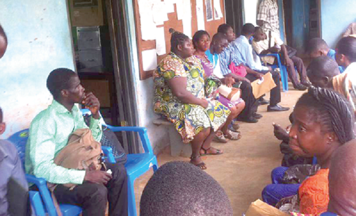Some of the applicants waiting to be interviewed at the Nkwanta-North district education office.