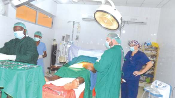 Members of the medical team operating on one of the patients