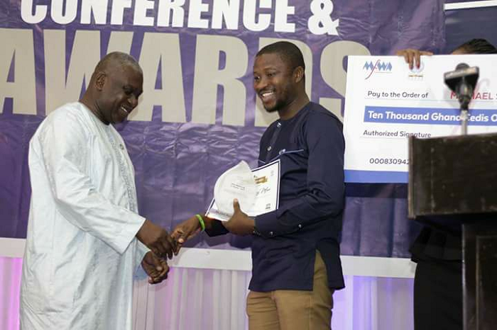 Michael Sarpong Mfum receiving his award at the event on Saturday night