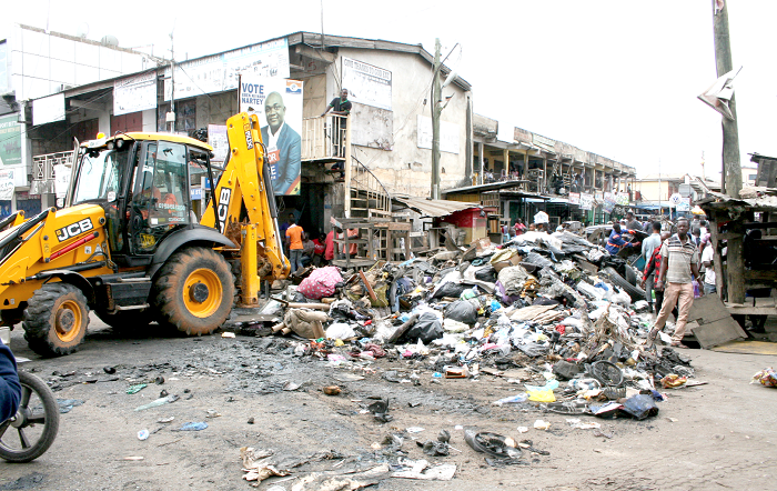  Some residents of Abossey Okai clearing refuse. Picture: INNOCENT K. OWUSU