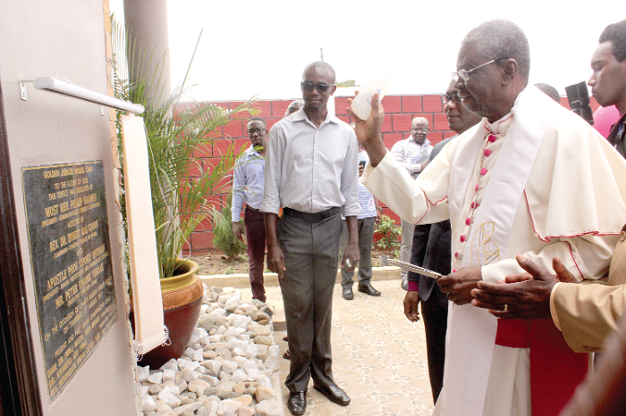 The Most Rev. Philip Naameh (right), the President, Ghana Catholic Bishops' Conference, consecrating the building. 