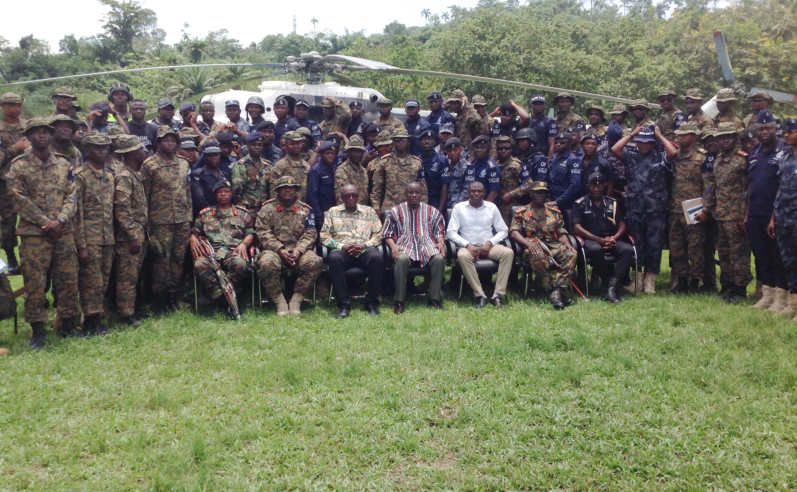 Mr Nitiwul (in smock), Mr Dery (seated 3rd left ) and some other security chiefs with members of Operation Vanguard in Tarkwa.