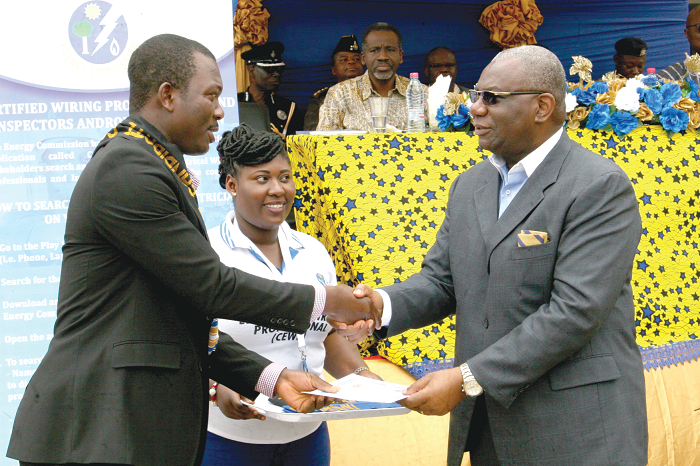 Mr Boakye Agyarko (right),  presenting a certificate to Mr Danso Akosah Mathias (left), Best student in Domestic Electrical Wiring. Picture: INNOCENT K. OWUSU