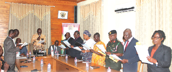  Mr Ambrose Dery (with mic), the Minister of the Interior, swearing in members of the National Disaster Management Organisation  (NADMO) Board. Pictures: MAXWELL OCLOO