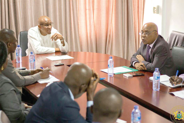 Mr Mustapha Abdul Hamid, Minister of Information holding discussions with Mr Tirso A. S Dos Santos in Accra 