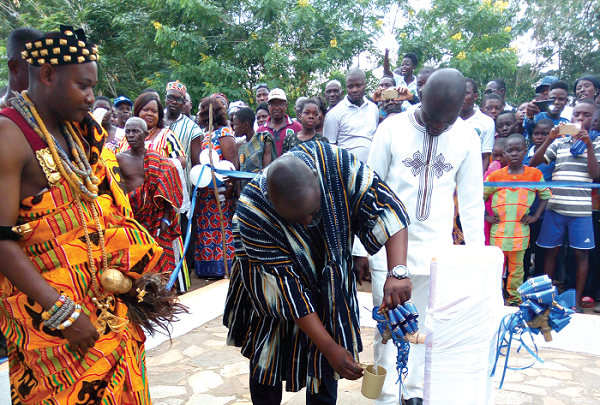  Mr Blagogee turning the tap to inaugurate the water facility