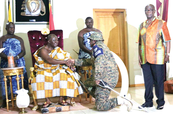 Col. William Agyapong (right),  Commander,  Operation Vanguard, being welcomed to the Manhyia Palace in Kumasi,  during a courtesy call on the Asantehene, Otumfuo Osei Tutu II. Picture: EMMANUEL BAAH
