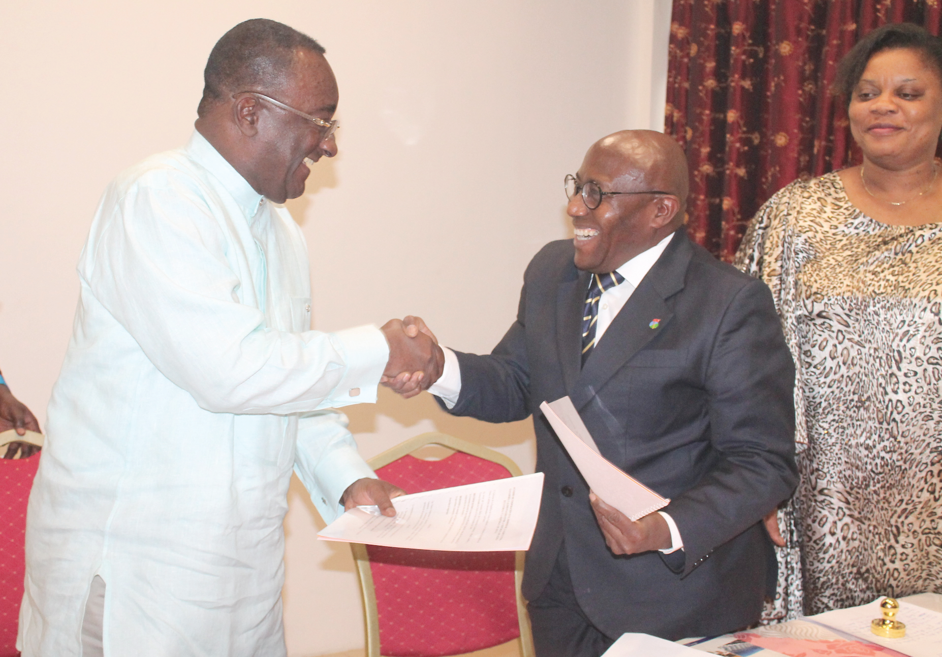 Dr Owusu Afriyie Akoto (left) and Mr Victor Grange Mehile (2nd left), Minister of Agriculture, Animal Husbandry and Food, Equatorial Guinea, exchanging the signed documents. Looking on is Mrs Maria Cristina Yehousessi Mikue (3rd left), Consular of Embassy of Equatorial Guinea in Ghana