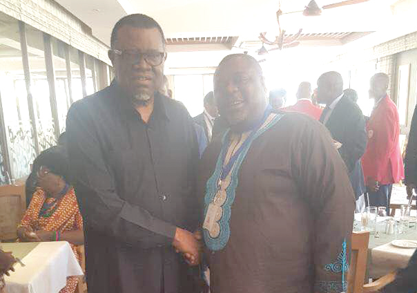 Mr Koku Anyidoho (right) in a handshake with Dr Hage Geingob, the President of Namibia