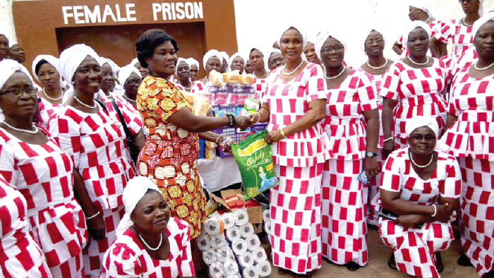 Mrs Omari-Mireku (right) presenting the items to ASP Hammond