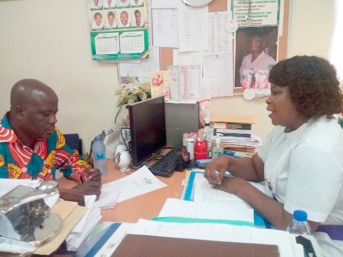 Ms Irene Mensah-Jacobs (right), Deputy Director of the centre explaining a point to the writer, Timothy Gobah