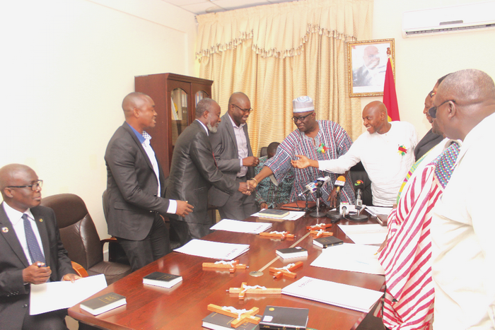 Mr Kofi Adda (4th left) congratulating members of the GWCL Board after the inauguration. 
