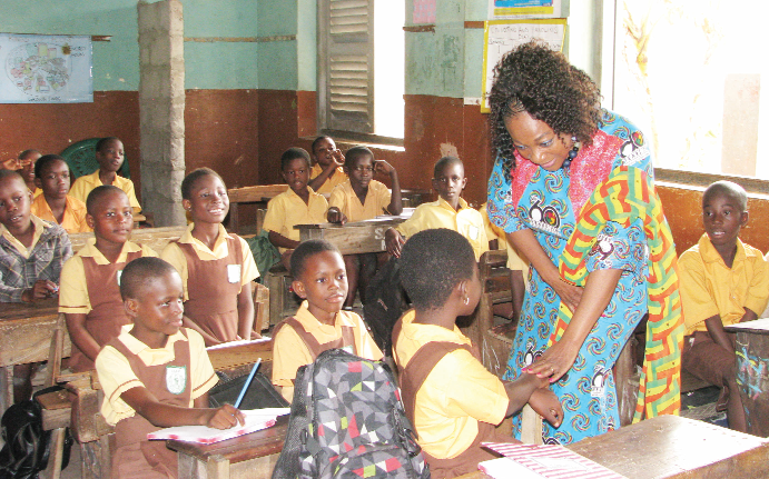 Ms Otiko Afisa Djaba, Minister for Gender, Children and Social Protection, interacting with some pupils. Pictures: ESTHER ADJEI