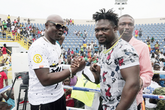 Braimah Kamoko (left) shaking hands with Bastie Samir