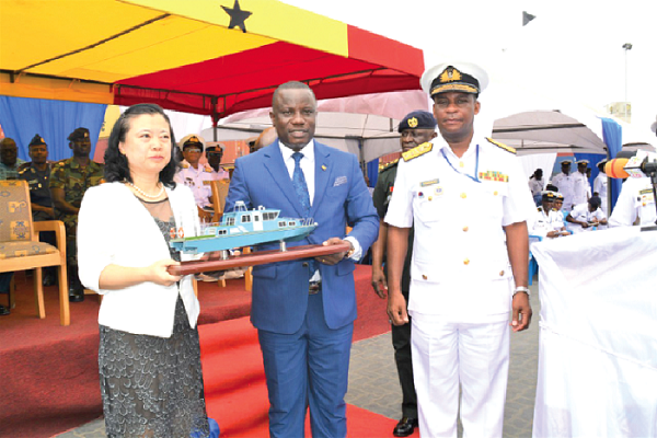  Madam Sun Baohong (left) presenting a miniature of the patrol boats to Mr Nitiwul, while Rear Admiral Peter Kofi Fiadoo, Chief of Naval Staff looks on.  INSET: The patrol boats which were presented to the Navy as part of the Chinese government's security cooperation with Ghana. Pictures: DELLA RUSSEL OCLOO