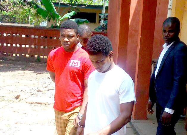 Daniel Asiedu (right) and Vincent Bosso  being escorted out of the court premises
