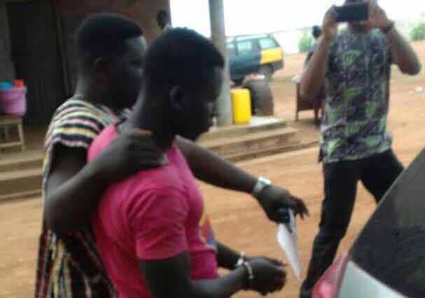 Emmanuel Baidoo being escorted out of the court