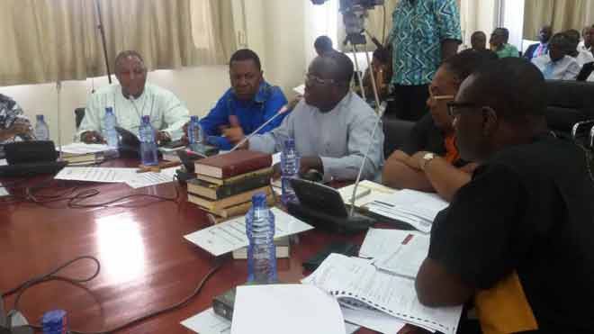 Mr Kingsley Aboagye-Gyedu (middle) a Deputy Minister of Health, answering questions before the Public Accounts Committee of Parliament