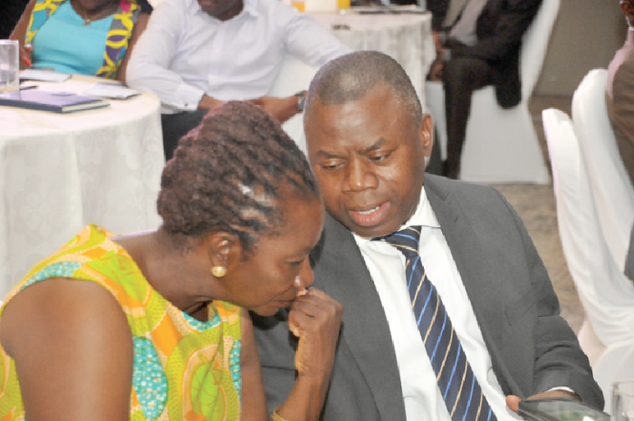Mr Alkhassan Andani interacting with Ms Ellaine Kwami, Board member of the Graphic Communications Group Limited