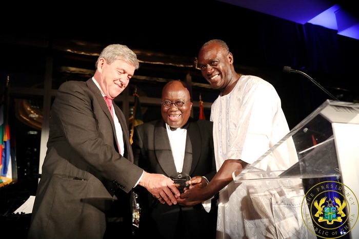 Steve Pfeiffer and Kofi Appenteng, President and CEO of the Africa America Institute, presenting the National Achievement Award to President Akufo-Addo