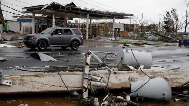  Hurricane Maria damaged buildings in Puerto Rico and left streets covered in debris 