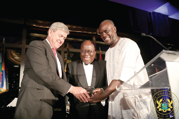 Steve Pfeiffer and Kofi Appenteng, President and CEO of the Africa America Institute presenting the National Achievement Award to President Nana Addo Dankwa Akufo-Addo (middle)